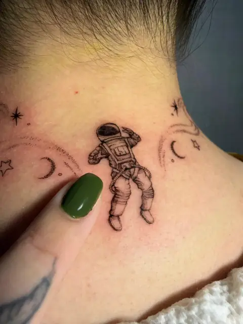 Detail of the astronaut — soft shading and a fine-line suit.