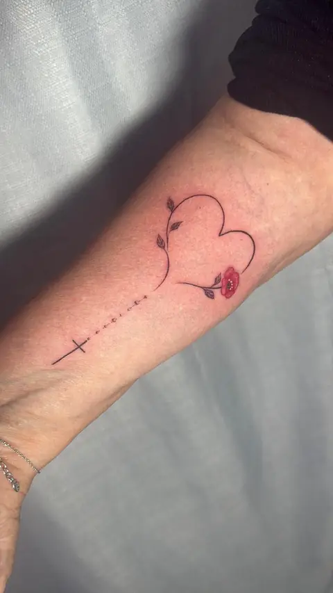 A stem-drawn heart and poppy, joined to a small cross in fine line.