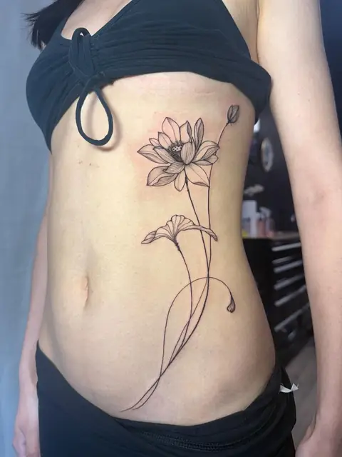 A lotus and a bellflower along the ribs, stems following the body.